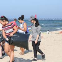 group of students pick up trash